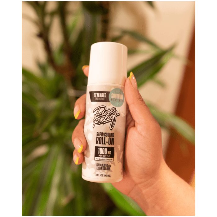 Pure Relief Hemp Rapid Cooling Roll-On (1800 mg Total CBD) Hand Holding Bottle