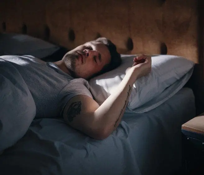 man sleeping after taking CBD
